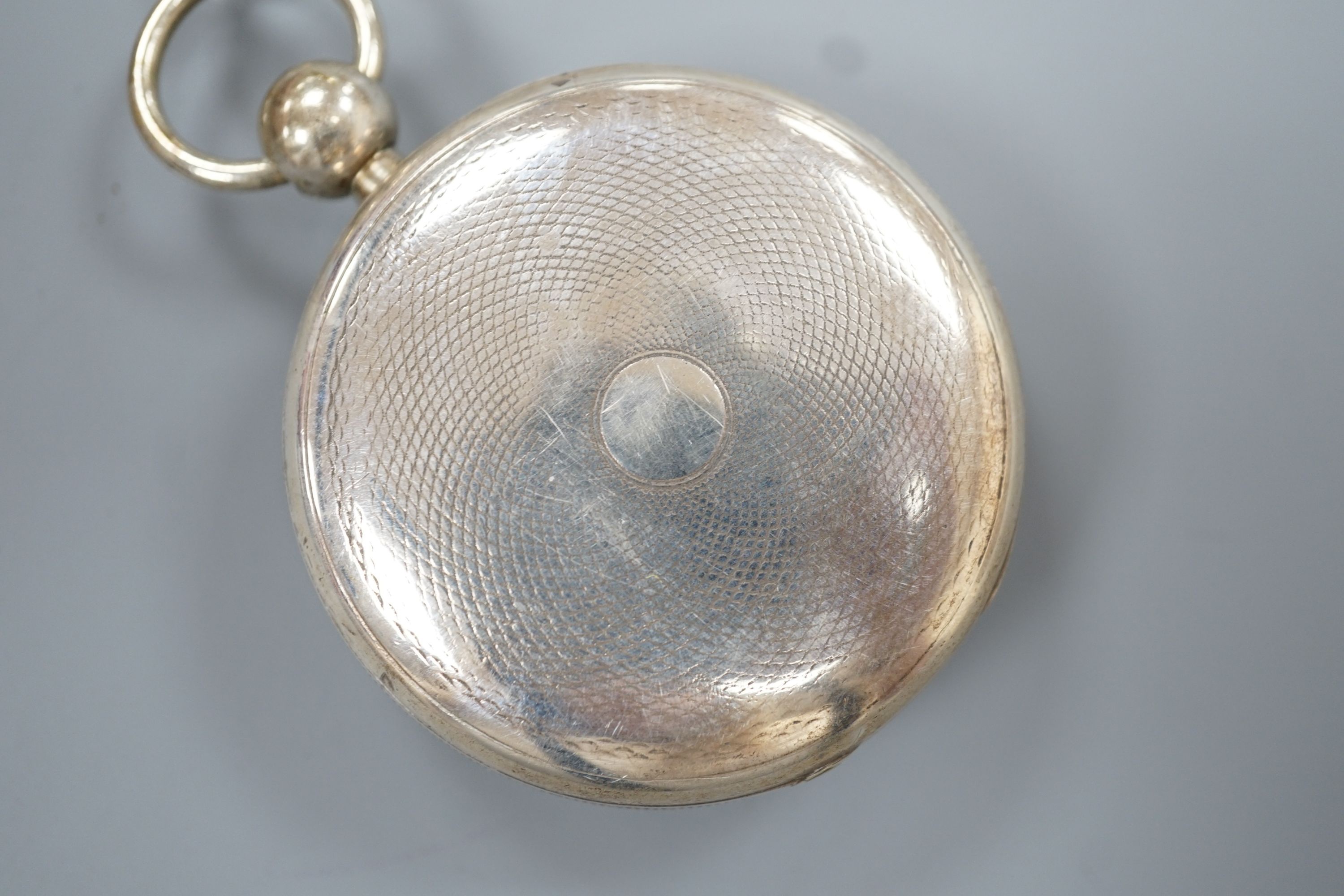 A Victorian engine turned silver open face keywind pocket watch, with gilt numeral Roman dial, case diameter 50mm.
